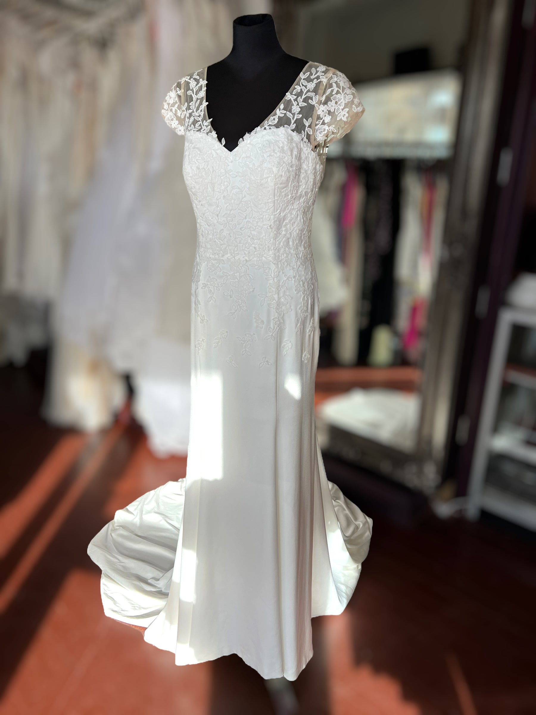 Crepe wedding dress with lace cap sleeves