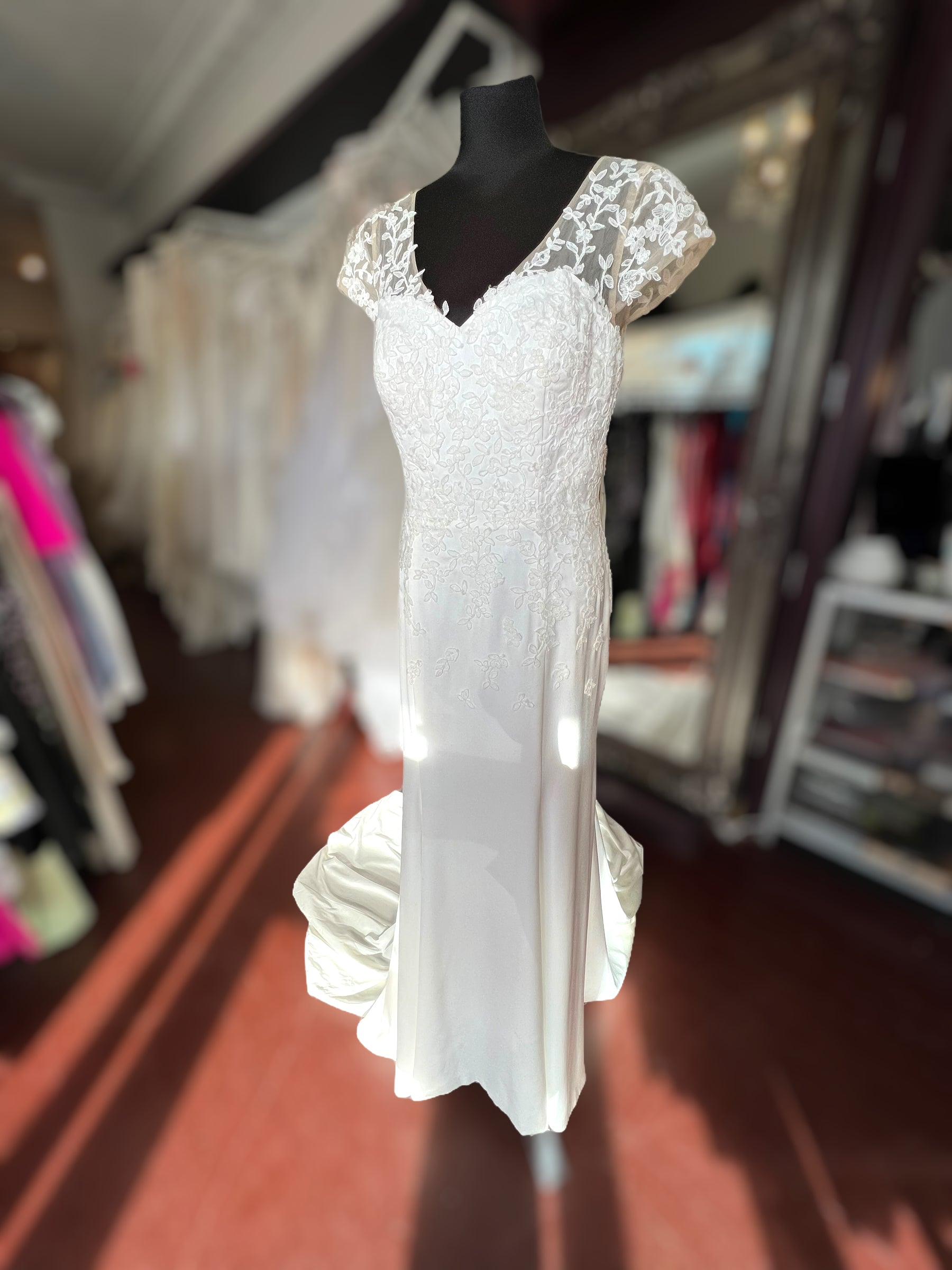 Crepe wedding dress with lace cap sleeves