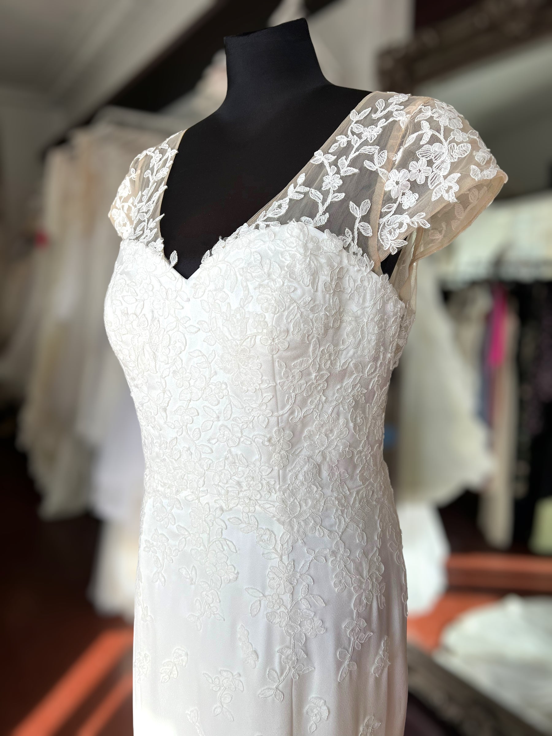 Crepe wedding dress with lace cap sleeves