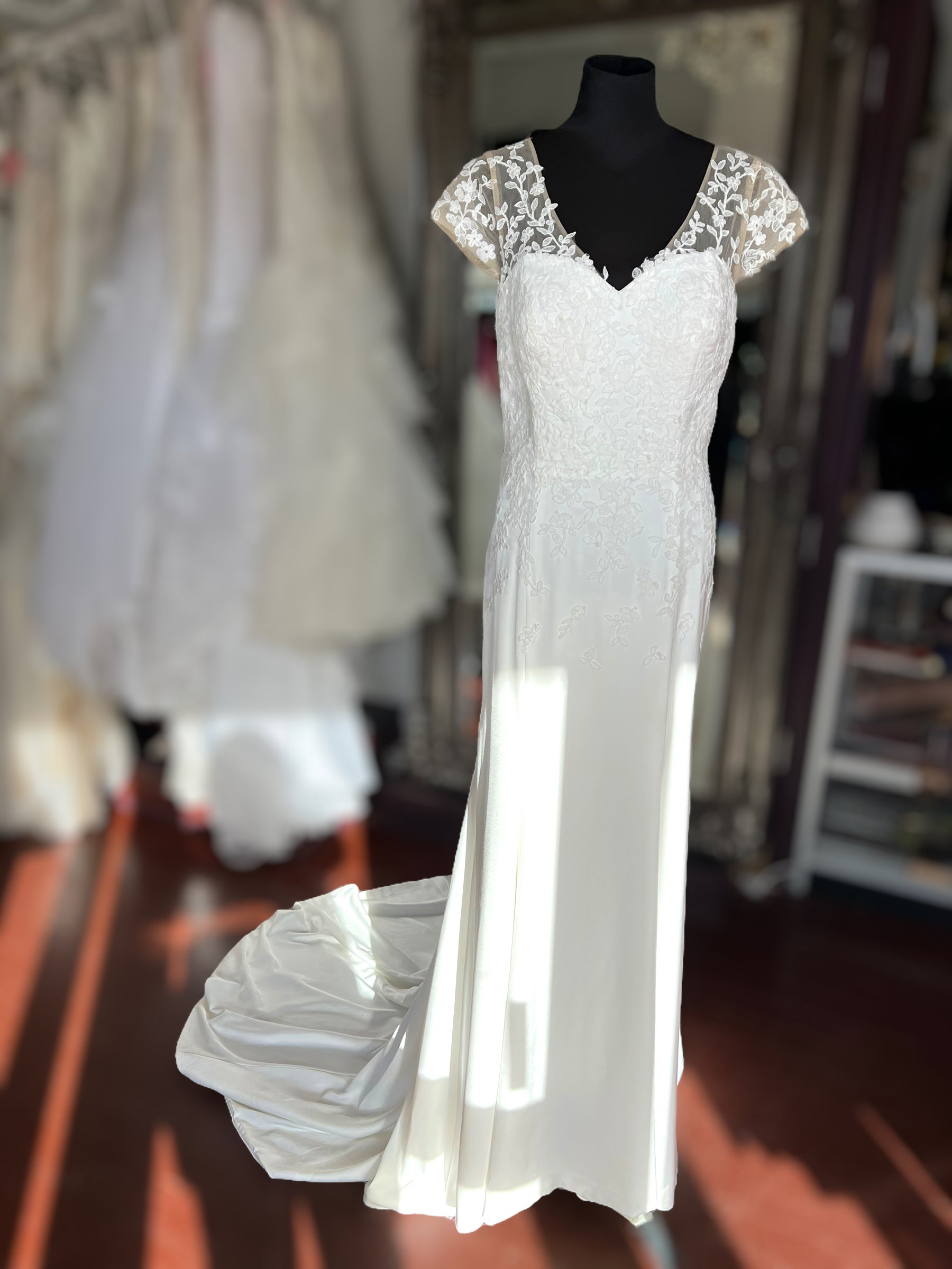 Crepe wedding dress with lace cap sleeves