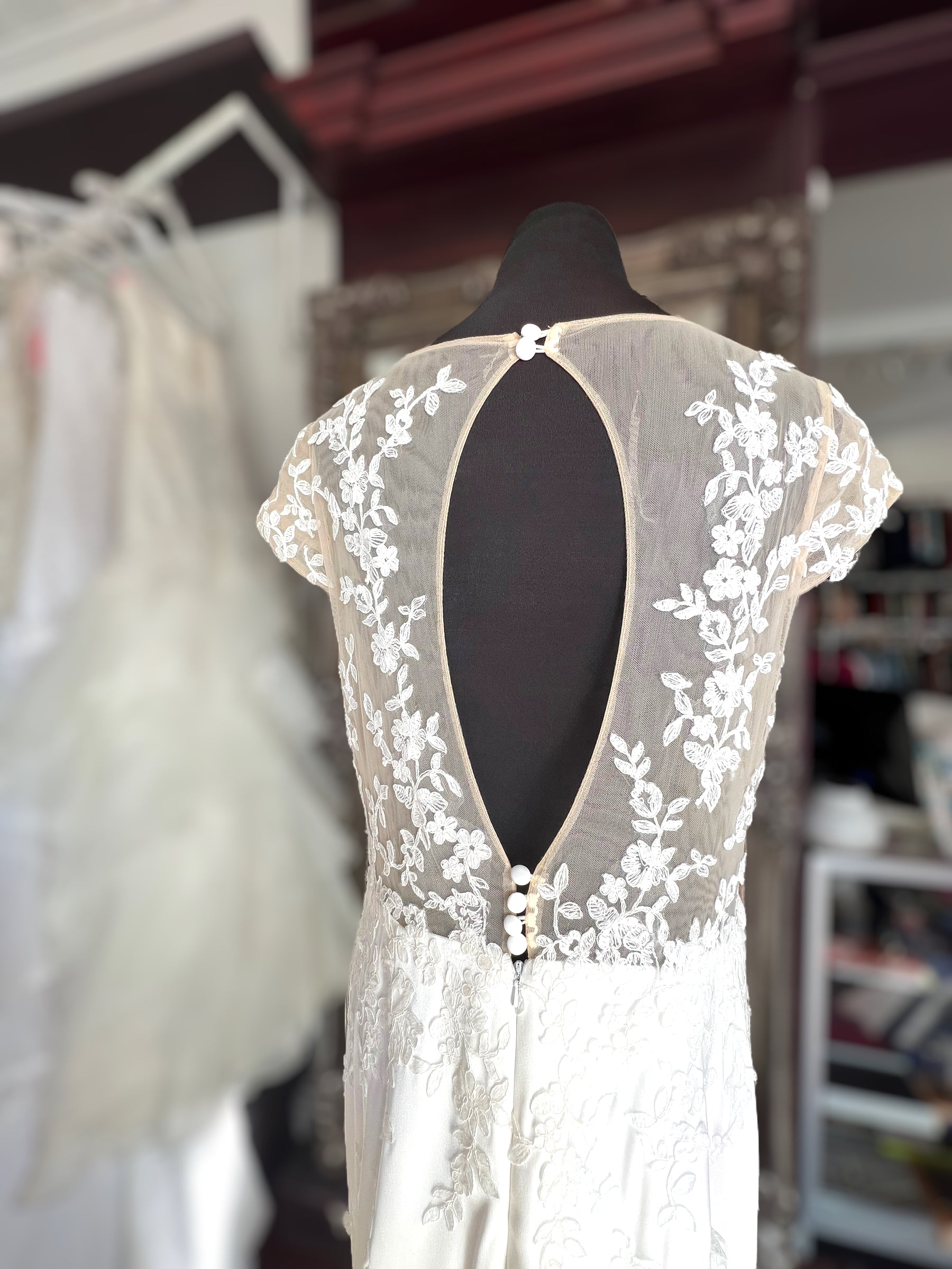 Crepe wedding dress with lace cap sleeves