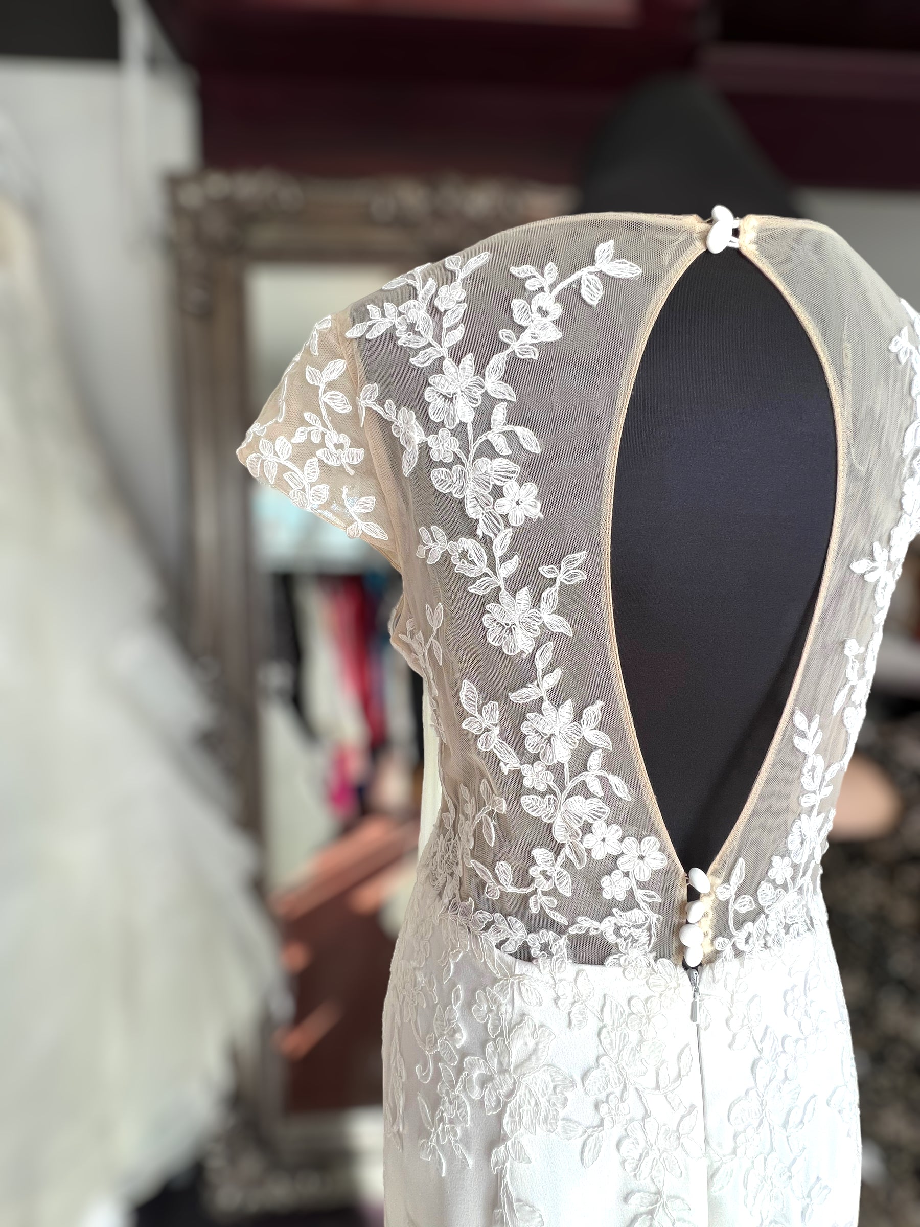 Crepe wedding dress with lace cap sleeves